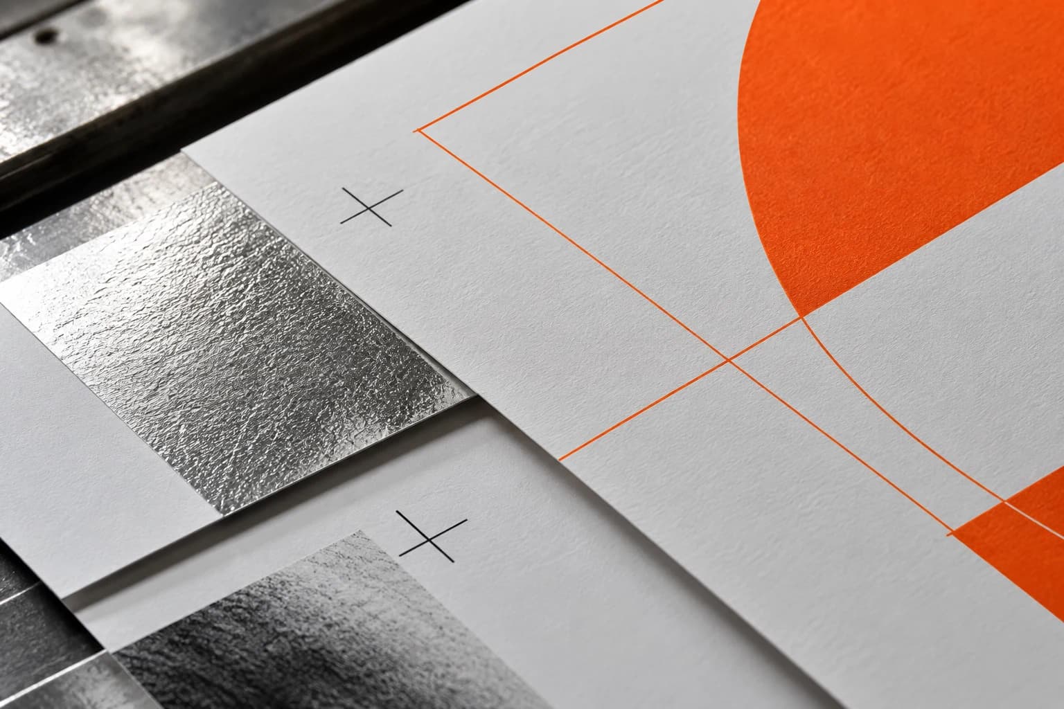 Orange graphic studies and registration details on paper